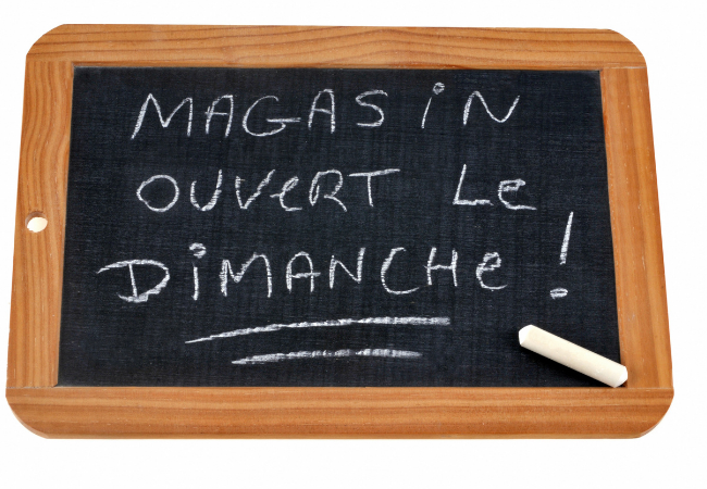 Translation of French sign: "Store Open On Sundays"