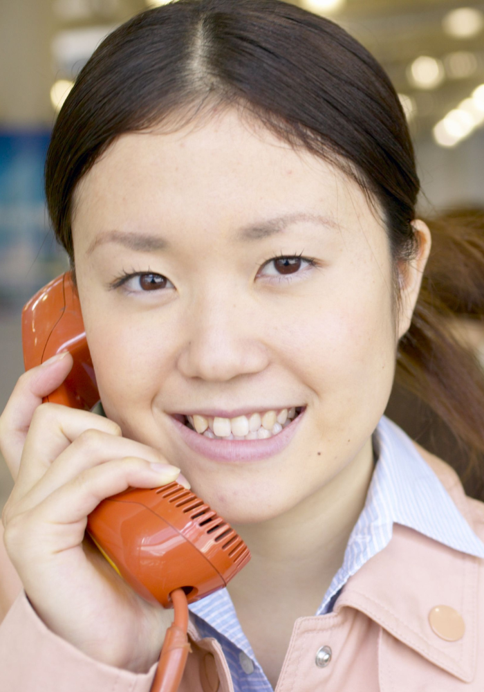 Image: Woman talking on telephone.