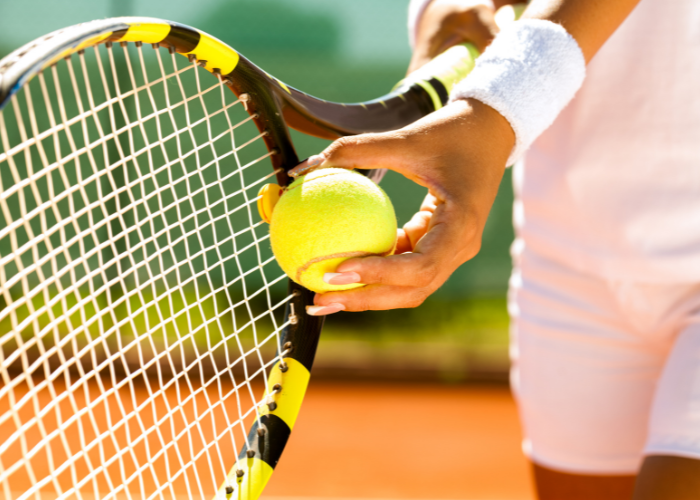 Image: Tennis ball and racket.