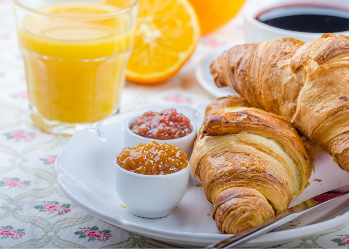 Example of a French breakfast: Croissants, jam and juice