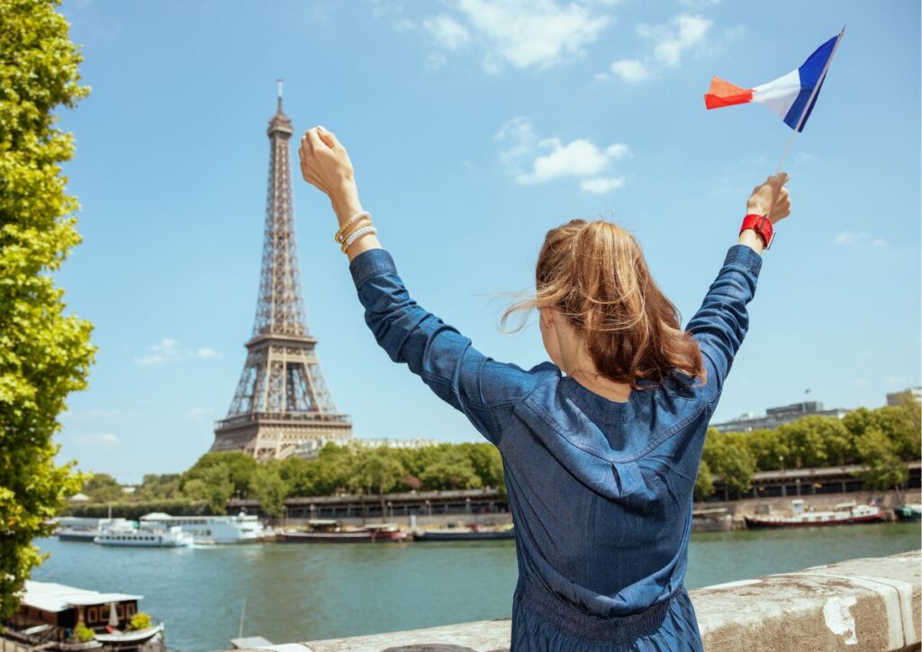 Girl in Paris holding French flag