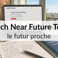 French near future tense (le futur proche) study desk with laptop, notebook, and Eiffel Tower view in Paris